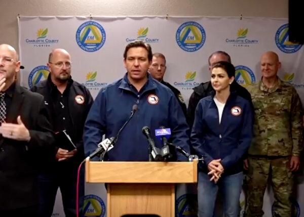 Florida Gov. Ron DeSantis (C) issues updates on Hurricane Ian, flanked by with Division of Emergency Management Director Kevin Guthrie (L) at the State Emergency Operations Center in Tallahassee, Fla., on Sept. 29, 2022. (Florida Governor's Office via Reuters/Screenshot via The Epoch Times