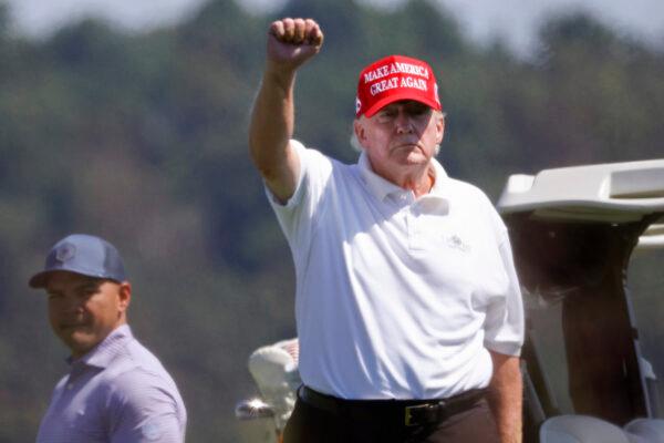 Former President Donald Trump gestures while golfing at Trump National Golf Club in Sterling, Va., on Sept. 13, 2022. (Win McNamee/Getty Images)