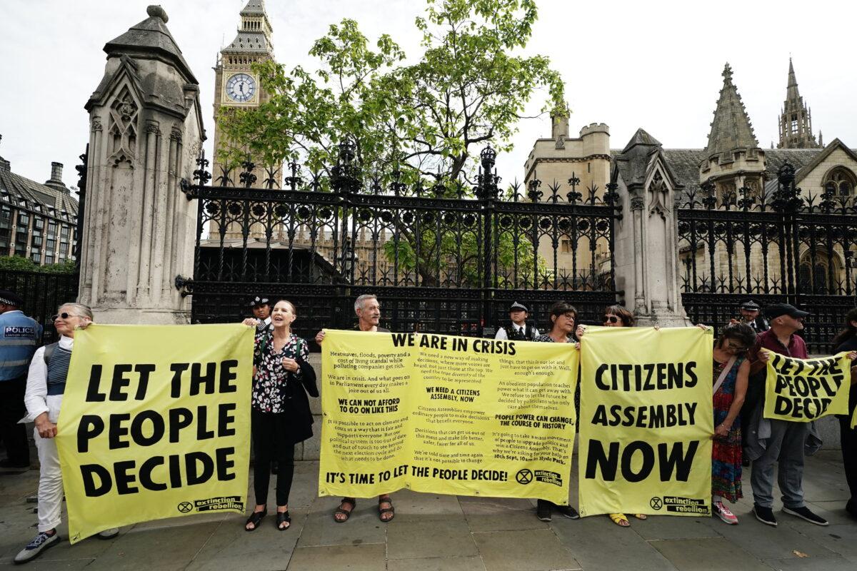 Extinction Rebellion protesters outside the Houses of Parliament, Westminster, London, on Sept. 2, 2022. (Aaron Chown/PA Media)