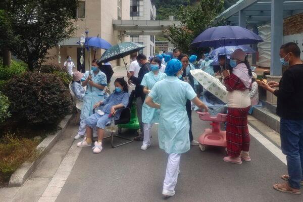 Medical workers and patients at Renmin Hospital of Shimian County in Ya'an City, in the aftermath of an earthquake in southwestern China's Sichuan Province, on Sept. 5, 2022. (Xinhua via AP)
