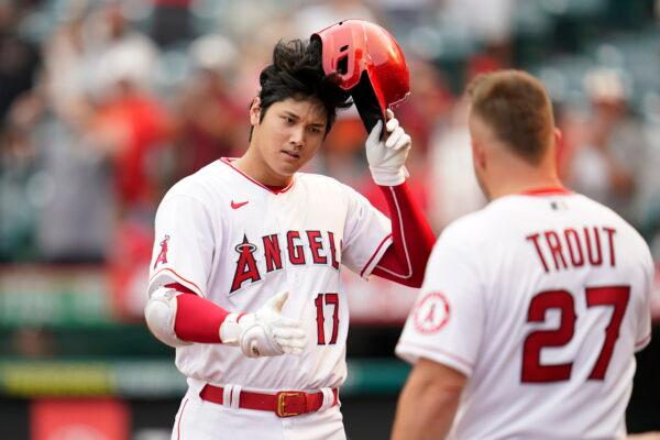 Los Angeles Angels designated hitter Shohei Ohtani (17) is greeted by Mike Trout (27) after hitting a home run during the seventh inning of a baseball game against the Detroit Tigers in Anaheim, Calif., on Sept. 7, 2022. (Ashley Landis/AP Photo)