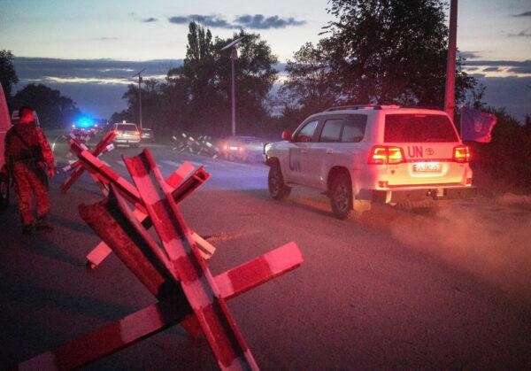 Amid Russia's invasion of Ukraine, a motorcade transporting a part of the International Atomic Energy Agency (IAEA) mission from the Zaporizhzhia nuclear power plant crosses a Ukrainian checkpoint in the Zaporizhzhia region of Ukraine, on Sept. 1, 2022. (Anna Voitenko/Reuters)