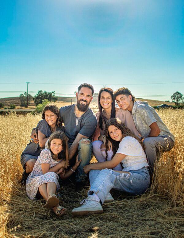 Super Bowl champion Eric Weddle with his wife, Chanel, and four children: his son, Gaige, and daughters Kamri (back row), Brooklyn (seated right), and Silver (seated left), photographed in<br/>Poway, Calif. (Heather Broomhall Photography)
