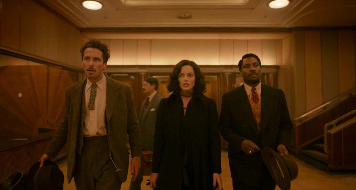 (L–R) Christian Bale, Margot Robbie, and John David Washington in "Amsterdam." (20th Century Studios)