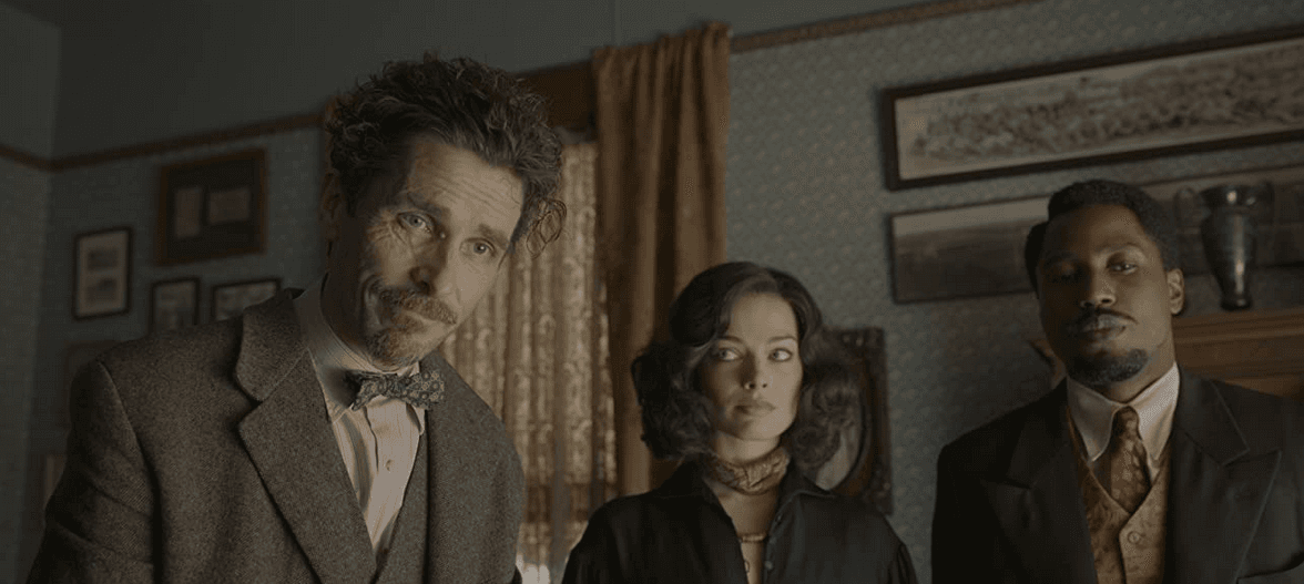 Christian Bale, Margot Robbie, and John David Washington bring laughs to a exhaustingly wacky riff on a real-life fascist conspiracy in 1930s New York, in "Amsterdam." (20th Century Studios)