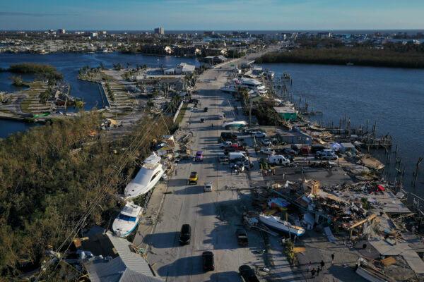 In this aerial view, boats sit grounded in a woodland area and along the side of the road after being pushed by rising water from Hurricane Ian near Fort Myers Beach in San Carlos Island, Fla., on Sept. 29, 2022. (Win McNamee/Getty Images)