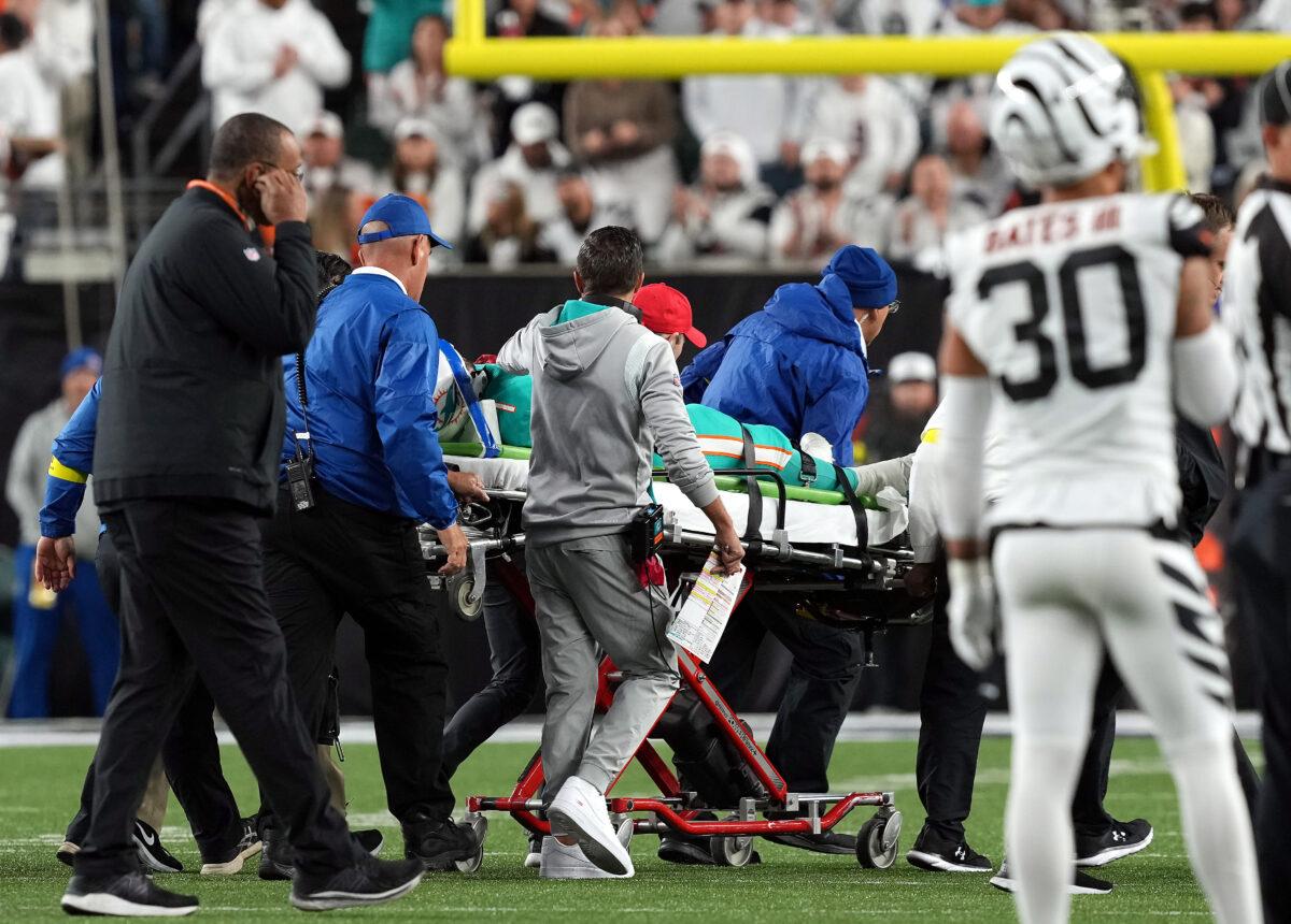 Medical staff tend to quarterback Tua Tagovailoa #1 of the Miami Dolphins as he is carted off on a stretcher after an injury during the 2nd quarter of the game against the Cincinnati Bengals at Paycor Stadium in Cincinnati, Ohio, on Sept. 29, 2022. (Dylan Buell/Getty Images)