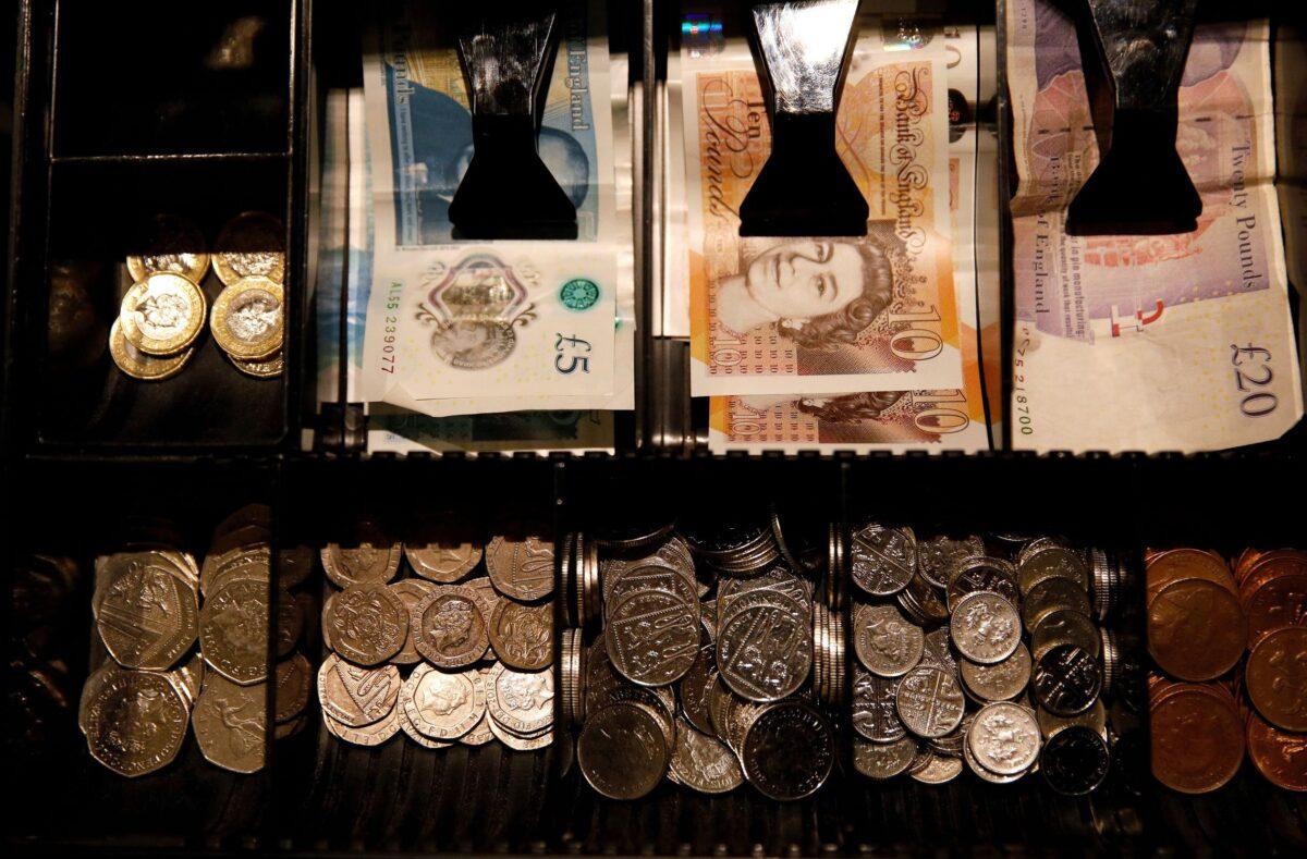 Pound Sterling notes and change are seen inside a cash register in a coffee shop in Manchester, England, on Sept. 21, 2018. (Phil Noble/Reuters)