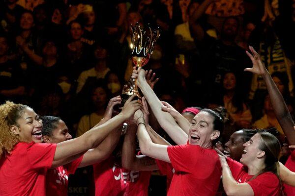 Players from the United States celebrate with with their trophy after defeating China in their gold medal game at the women's Basketball World Cup in Sydney, Australia, on Oct. 1, 2022. (Rick Rycroft/AP Photo)
