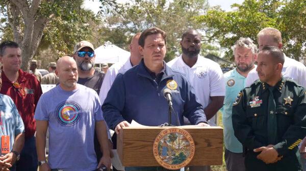 Florida Gov. Ron DeSantis (C) delivers an update on Hurricane Ian, in Fort Myers, Fla., on Oct. 1, 2022. (Florida Governor's Office via Reuters/Screenshot via NTD)