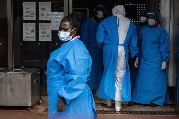 Members of the Ugandan Medical staff of the Ebola Treatment Unit stand inside the ward in Personal Protective Equipment (PPE) at Mubende Regional Referral Hospital in Uganda on Sept. 24, 2022.(Badru Katumba/AFP via Getty Images)