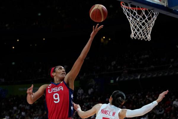 United States' A'ja Wilson, left, shoots over China's Yang Liwei during their gold medal game at the women's Basketball World Cup in Sydney, Australia, on Oct. 1, 2022. (Rick Rycroft/AP Photo)