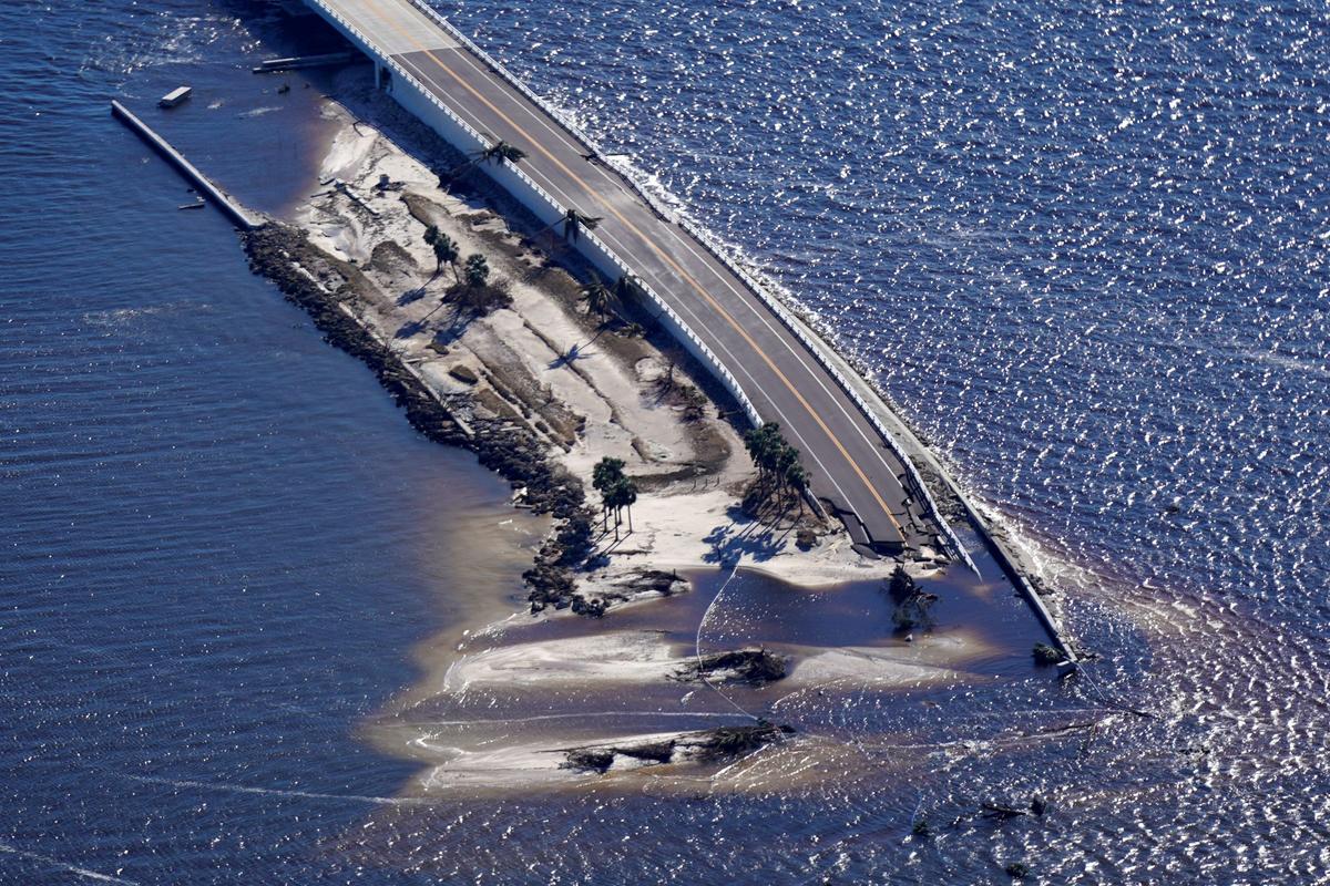 In this aerial photo made in a flight provided by mediccorps.org, damage from Hurricane Ian is seen on the causeway leading to Sanibel Island from Fort Myers, Fla., on Sept. 30, 2022. (Gerald Herbert/AP Photo)