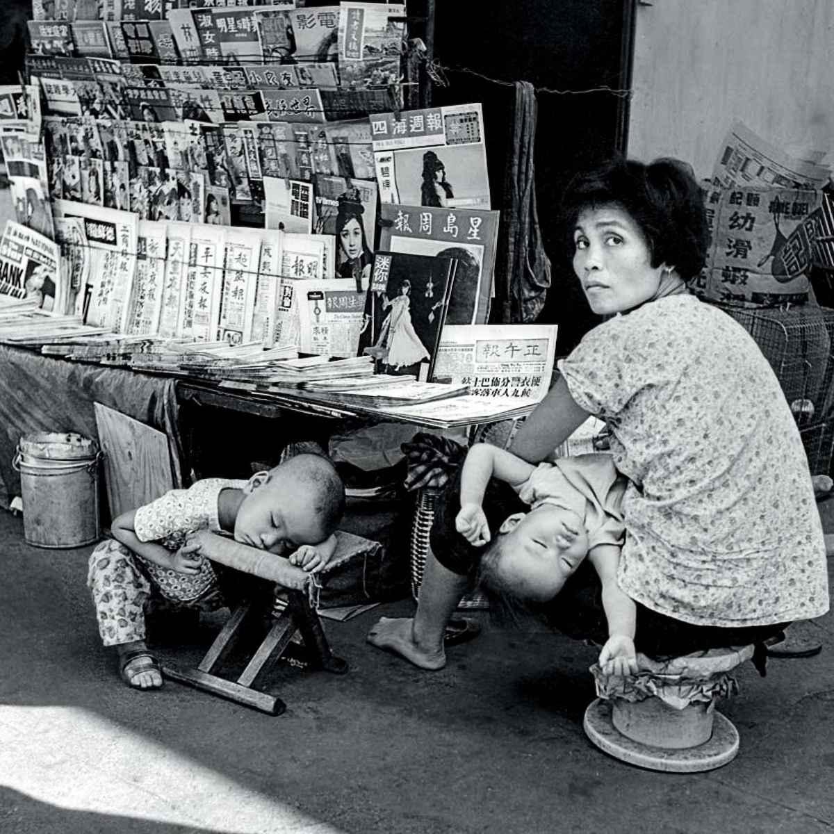 In the past, newspaper sellers brought their children to their stalls on the streets. (Courtesy of Eastpro Gallery)