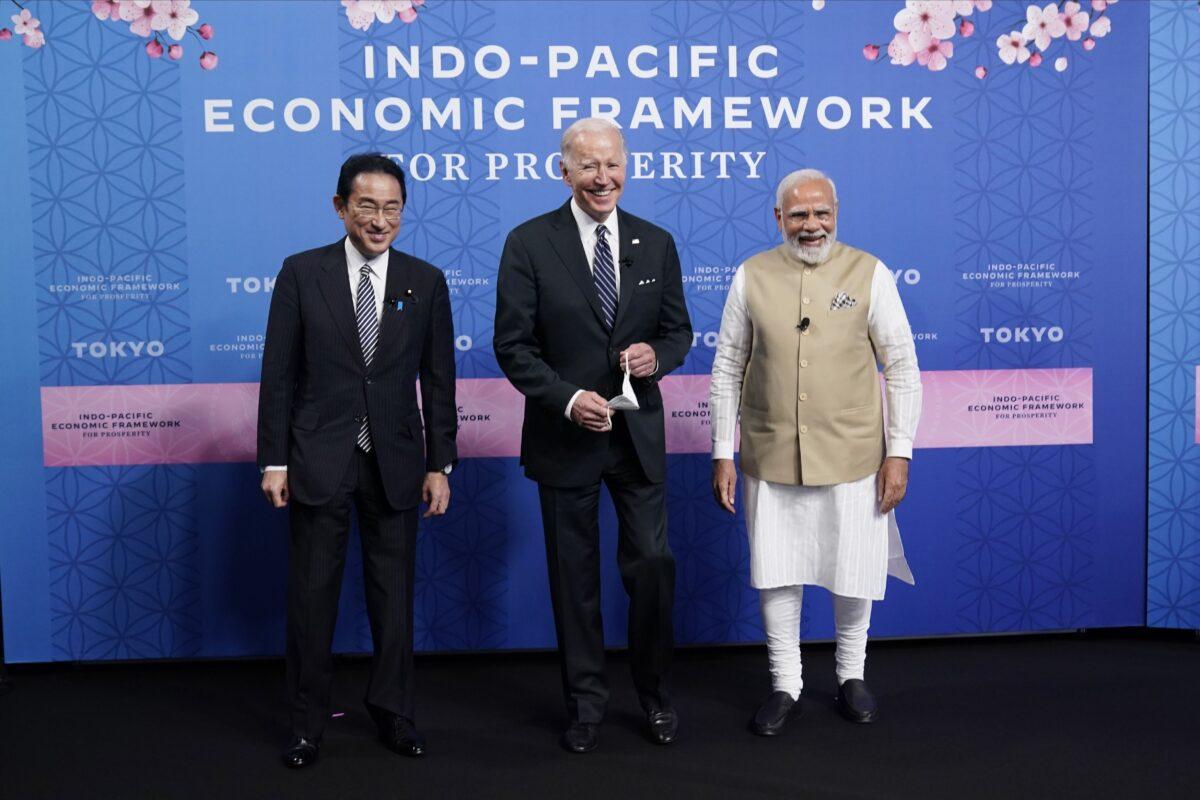 (L-R) Japanese Prime Minister Fumio Kishida, U.S. President Joe Biden, and Indian Prime Minister Narendra Modi pose for photos as they arrive at the Indo-Pacific Economic Framework for Prosperity launch event at the Izumi Garden Gallery in Tokyo, on May 23, 2022. (AP Photo/Evan Vucci)