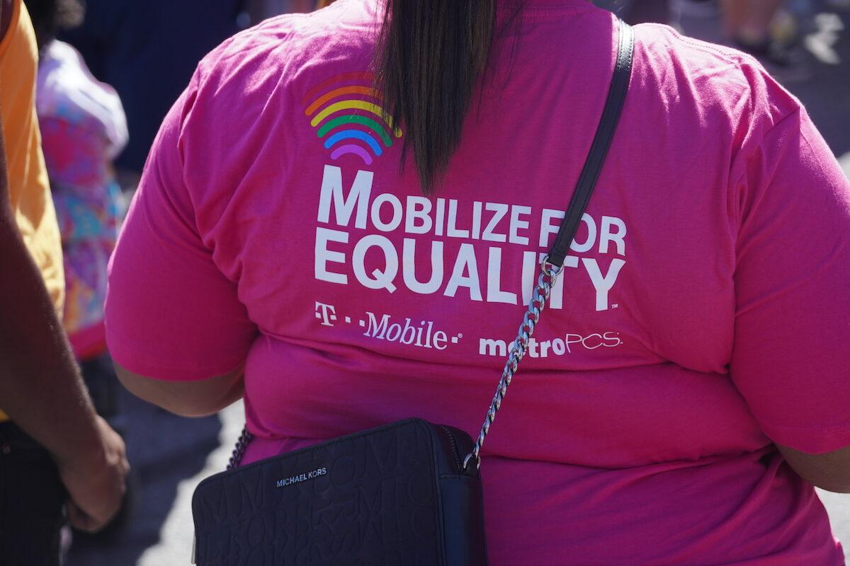 A T-Mobile employee with a shirt sponsored by her company for the Chattanooga Pride parade in Chattanooga, Tenn., on Oct. 2, 2022. (Jackson Elliott/The Epoch Times)