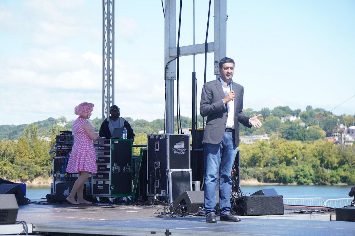 Congressman Ro Khanna (D-Calif.) speaks while Noah Corbin (L), performing as Hormona Lisa, waits behind him on stage at the Chattanooga Pride parade in Chattanooga, Tenn., on Oct. 2, 2022. (Jackson Elliott/The Epoch Times)