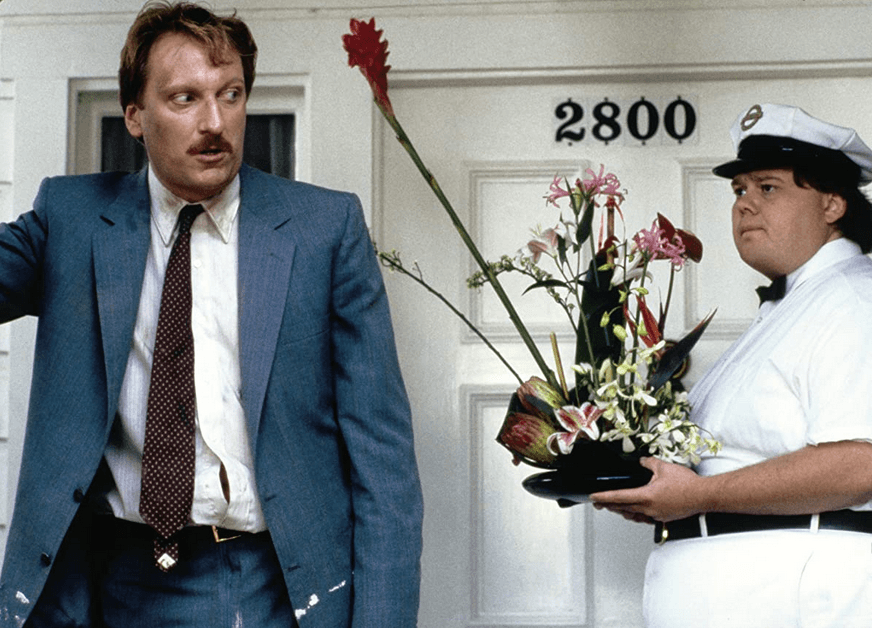 Principal Ed Rooney (Jeffrey Jones) and the flower delivery guy (Louie Anderson), in "Ferris Bueller's Day Off." (Paramount Pictures)