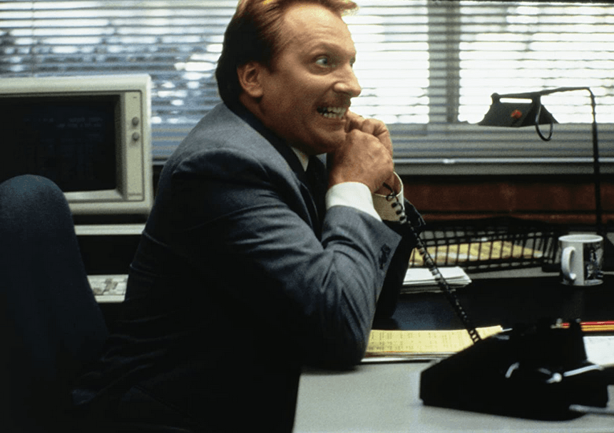 Principal Ed Rooney (Jeffrey Jones) on the phone with someone he thinks is Sloane Peterson's dad, in "Ferris Bueller's Day Off." (Paramount Pictures)