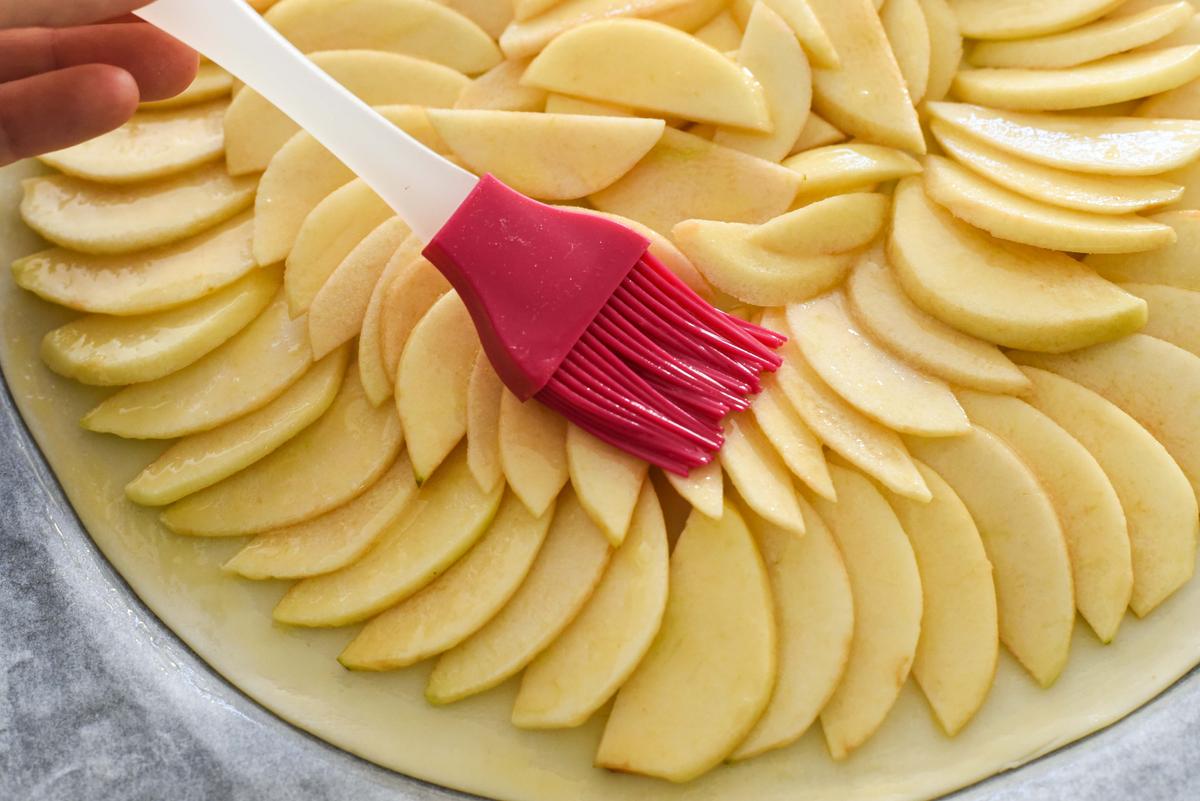 Lightly brush the apples with melted butter and sprinkle with sugar before baking. (Audrey Le Goff)