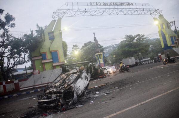 A torched car outside Kanjuruhan stadium in Malang, East Java, on Oct. 2, 2022. (Putri/AFP via Getty Images)
