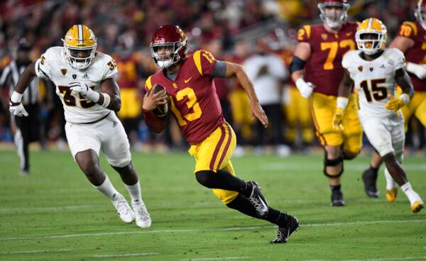 Quarterback Caleb Williams (13) of the USC Trojans rushes out of the pocket and gains a first down B.J. Green II (35) of the Arizona State Sun Devils during the second half at United Airlines Field at the Los Angeles Memorial Coliseum in Los Angeles, on Oct. 1, 2022. (Kevork Djansezian/Getty Images)