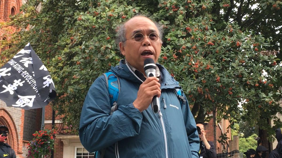 Chung Kim-wah, former Deputy Chief Executive of Hong Kong Public Opinion Research Institute, delivered a speech at the rally in Reading, on Oct 1, 2022. (Shan Lam/The Epoch Times)