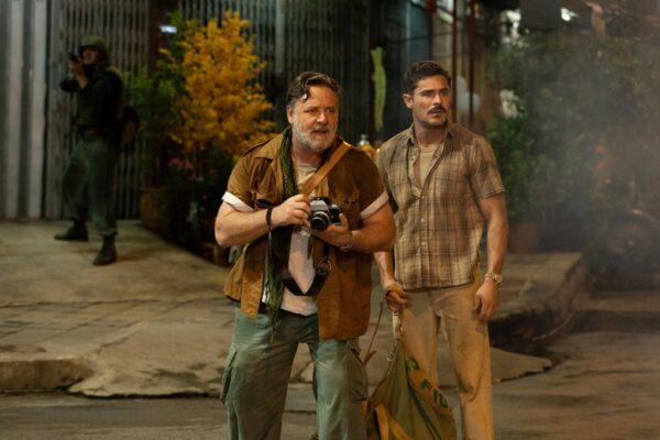 Russell Crowe as "Look" photographer Arthur Coates (L) and Zac Efron as "Chick" Donohoe in a scene from "The Greatest Beer Run Ever." (Apple Original Films)