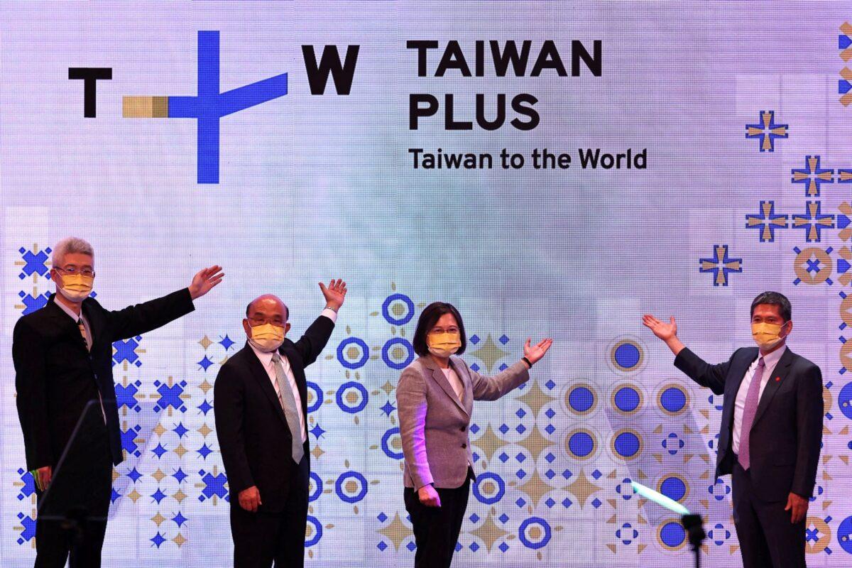 Taiwanese President Tsai Ing-wen (C) attends the television operations launch of TaiwanPlus, a government-backed English language news channel, in Taipei, Taiwan, on Oct. 3, 2022. (Ann Wang/Reuters)