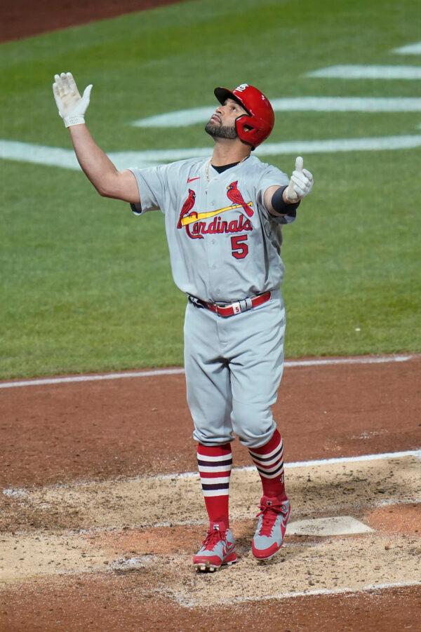 St. Louis Cardinals' Albert Pujols celebrates as he crosses home plate after he hit home run No. 703 in his career during the fifth inning of a baseball game against the Pittsburgh Pirates in Pittsburgh, on Oct. 3, 2022. (Keith Srakocic/AP Photo)