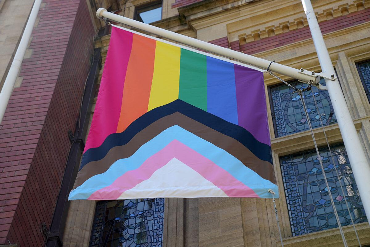 General view of the LGBTQIA+ (lesbian, gay, bisexual, transgender, questioning, intersex, asexual, and agender) flag outside a bookshop during UK Pride Month 2021 in London on June 1, 2021. (Edward Smith/Getty Images)