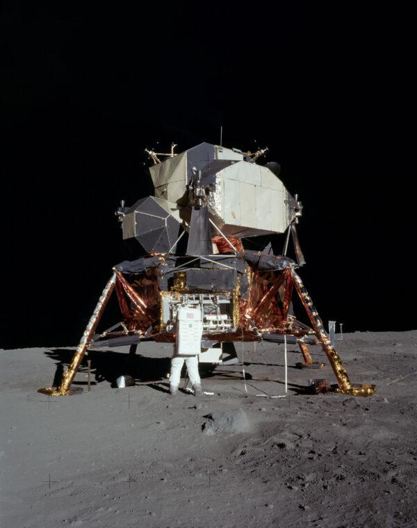 Buzz Aldrin removes the passive seismometer from a compartment in the SEQ bay of the Lunar Lander (Apollo 11 “Eagle”), July 21, 1969. (Public domain)