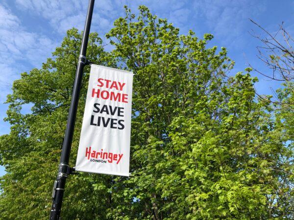 A sign from Haringey Council reminds people to stay at home near Alexandra Palace in London, on April 26, 2020. (Edward Smith/Getty Images)