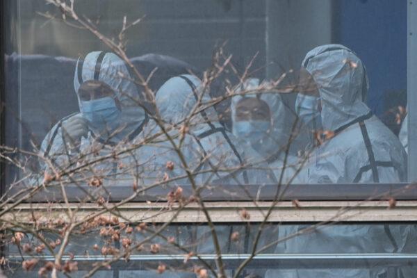 Members of the World Health Organization (WHO) team investigating the origins of COVID-19 during their visit to the Hubei Center for animal disease control and prevention in Wuhan, Hubei Province on Feb. 2, 2021. (Hector Retamal/AFP via Getty Images)