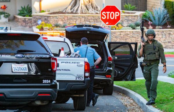 Orange County law enforcement agencies work together in arresting a suspect barricaded in a Newport Beach home on Oct. 4, 2022. (John Fredricks/The Epoch Times)