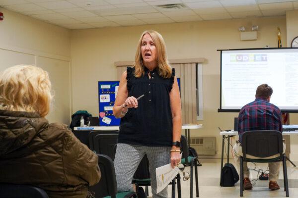 Anne Friedel, a resident of the Town of Mount Hope and a committee member of Friends of Minisink Valley Public Library, answers questions at the library public hearing at Greenville Resource Center, N.Y., on Oct. 4, 2022. (Cara Ding/The Epoch Times)
