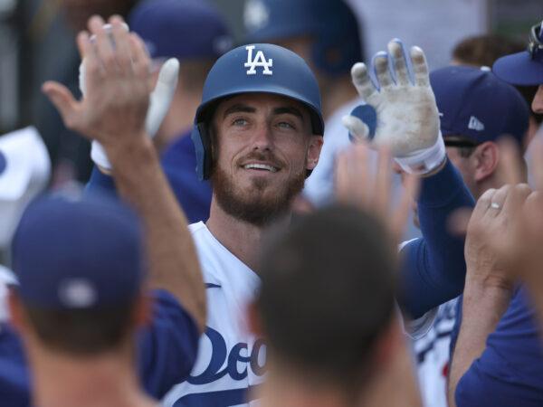 Cody Bellinger #35 of the Los Angeles Dodgers celebrates his solo home run in the dugout, to take a 5–1 lead over the Colorado Rockies, during the seventh inning at Dodger Stadium on October 05, 2022 in Los Angeles, California. (Photo by Harry How/Getty Images)