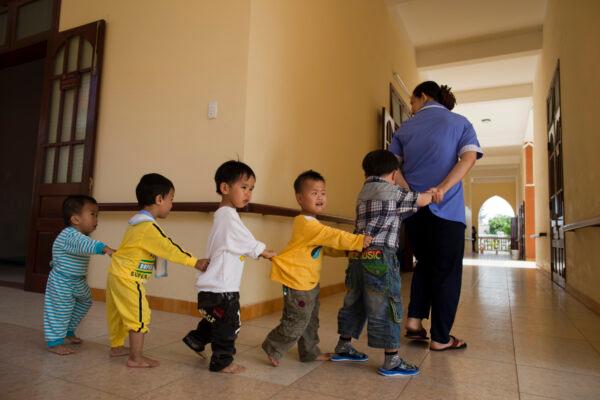 Pre-school handicapped children play games at the Thanh Tam Special school in Danang, Vietnam on March 6, 2011. (Paula Bronstein /Getty Images)