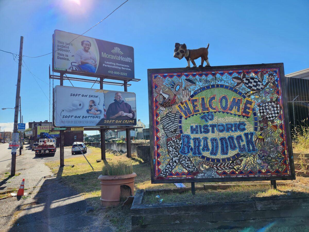 A billboard from Mehmet Oz's campaign about John Fetterman stands at the entrance of Braddock, Pa., where Fetterman lives and served as mayor for several years. (Jeff Louderback(Epoch Times)