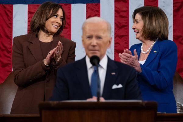 Vice President Kamala Harris, left, and House Speaker Nancy Pelosi, right, applaud as Joe Biden delivers the State of the Union address to a joint session of Congress in the U.S. Capitol House Chamber in Washington on March 1, 2022. (Saul Loeb/Pool/Getty Images)