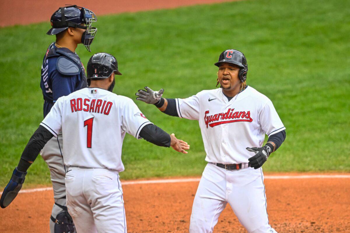 Cleveland Guardians third baseman Jose Ramirez (11) reacts with shortstop Amed Rosario (1) after hitting a two run home run against the Tampa Bay Rays in the sixth inning during game one of the Wild Card series for the 2022 MLB Playoffs at Progressive Field in Cleveland, Ohio, on Oct 7, 2022. (David Richard/USA TODAY Sports via Reuters)