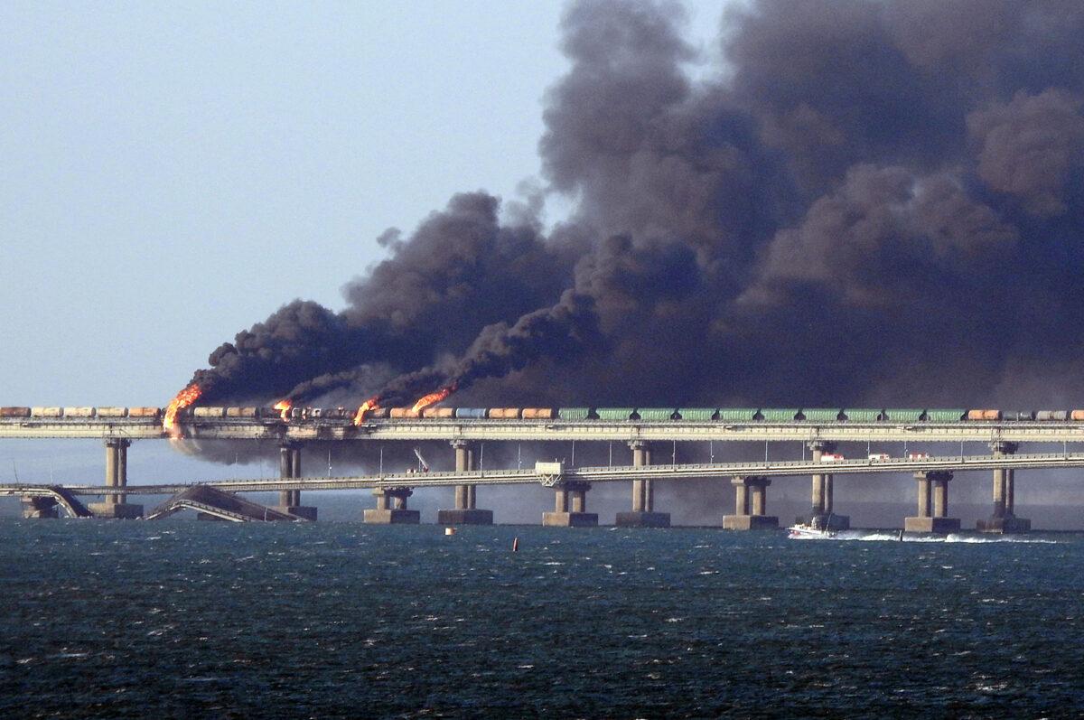 Black smoke billows from a fire on the Kerch bridge that links Crimea to Russia after a truck exploded near Kerch, Ukraine, on Oct. 8, 2022. (AFP via Getty Images)