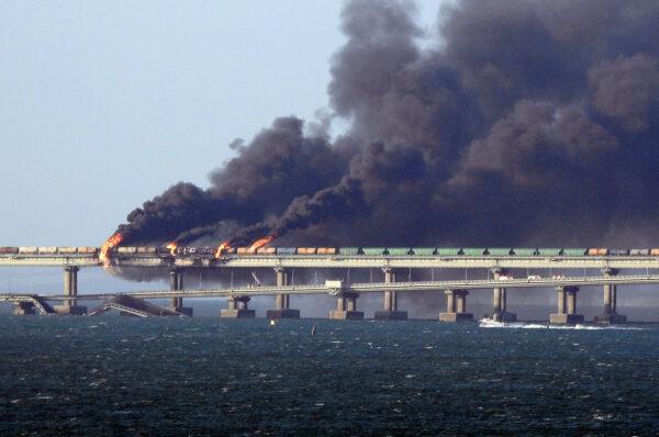 Black smoke billows from a fire on the Kerch bridge that links Crimea to Russia, after a truck exploded near Kerch on Oct. 8, 2022. (AFP via Getty Images)