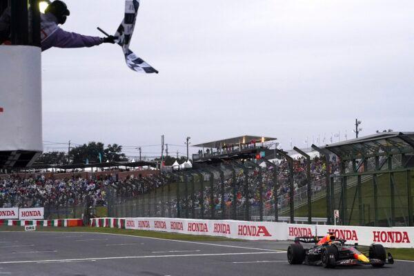 Red Bull driver Max Verstappen of the Netherlands crossed the finish line to win the Japanese Formula One Grand Prix at the Suzuka Circuit in Suzuka, central Japan, on Oct. 9, 2022. (Toru Hanai/AP Photo)