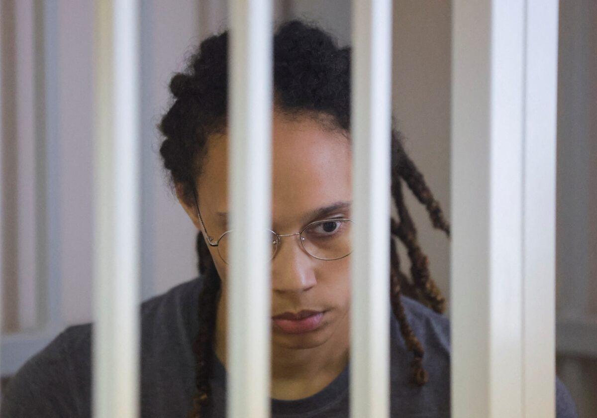 U.S. basketball player Brittney Griner, who was detained at Moscow's Sheremetyevo airport and later charged with illegal possession of cannabis, sits inside a defendants' cage during the reading of the court's verdict in Khimki outside Moscow, Russia, on Aug. 4, 2022. (Evgenia Novozhenina/Reuters)