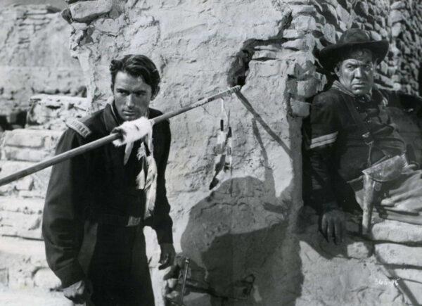 Capt. Richard Lance (Gregory Peck, L) and Cpl. Timothy Gilchrist (Ward Bond) find themselves in a tense situation, in “‘Only the Valiant.” (Warner Bros)