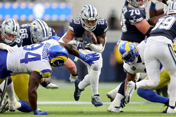 Tony Pollard (20) of the Dallas Cowboys runs against the Los Angeles Rams during the fourth quarter at SoFi Stadium in Inglewood, Calif., on Oct. 9, 2022. (Sean M. Haffey/Getty Images)