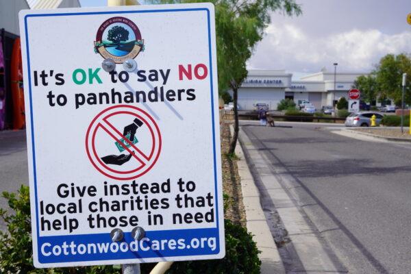 Cottonwood Police Chief Stephen Gesell says these anti-panhandling signs were as it appears at a local Walmart on Oct. 5, 2022 to direct samaritan dollars to social services which serve the needy. (Allan Stein/The Epoch Times)