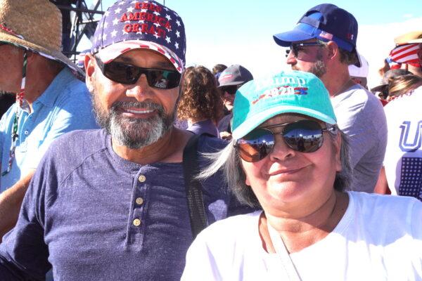 Benjamin Reyes and wife Hilda of Arizona say they're going to vote a straight Republican ticket in the November elections during a rally featuring former President Donald Trump in Mesa, Ariz., on Oct. 9. (Allan Stein/The Epoch Times)