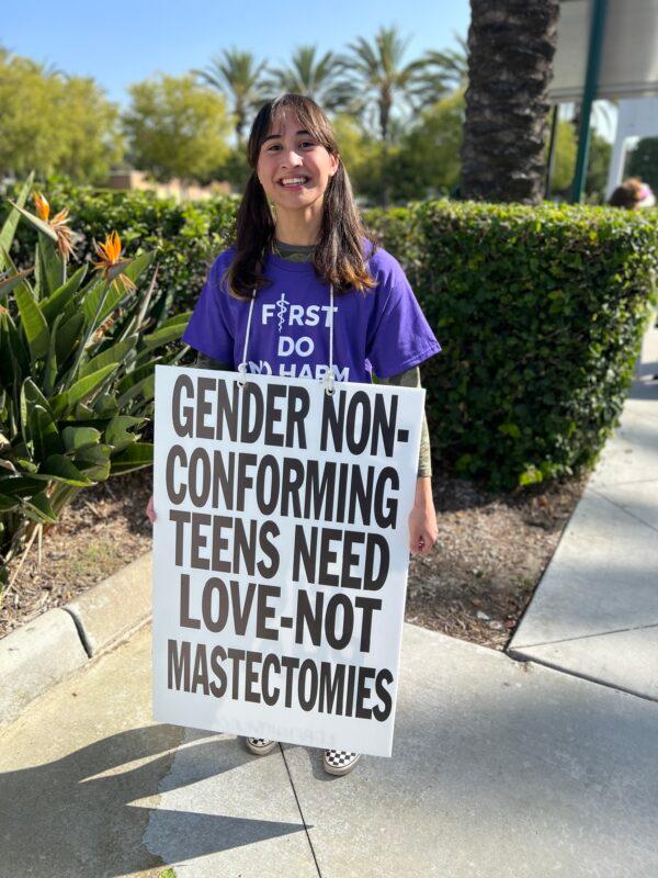 Chloe Cole, a girl, who, at one time, identified as a boy, takes part in a demonstration in Anaheim, Calif., on Oct. 8, 2022. (Brad Jones/The Epoch Times)